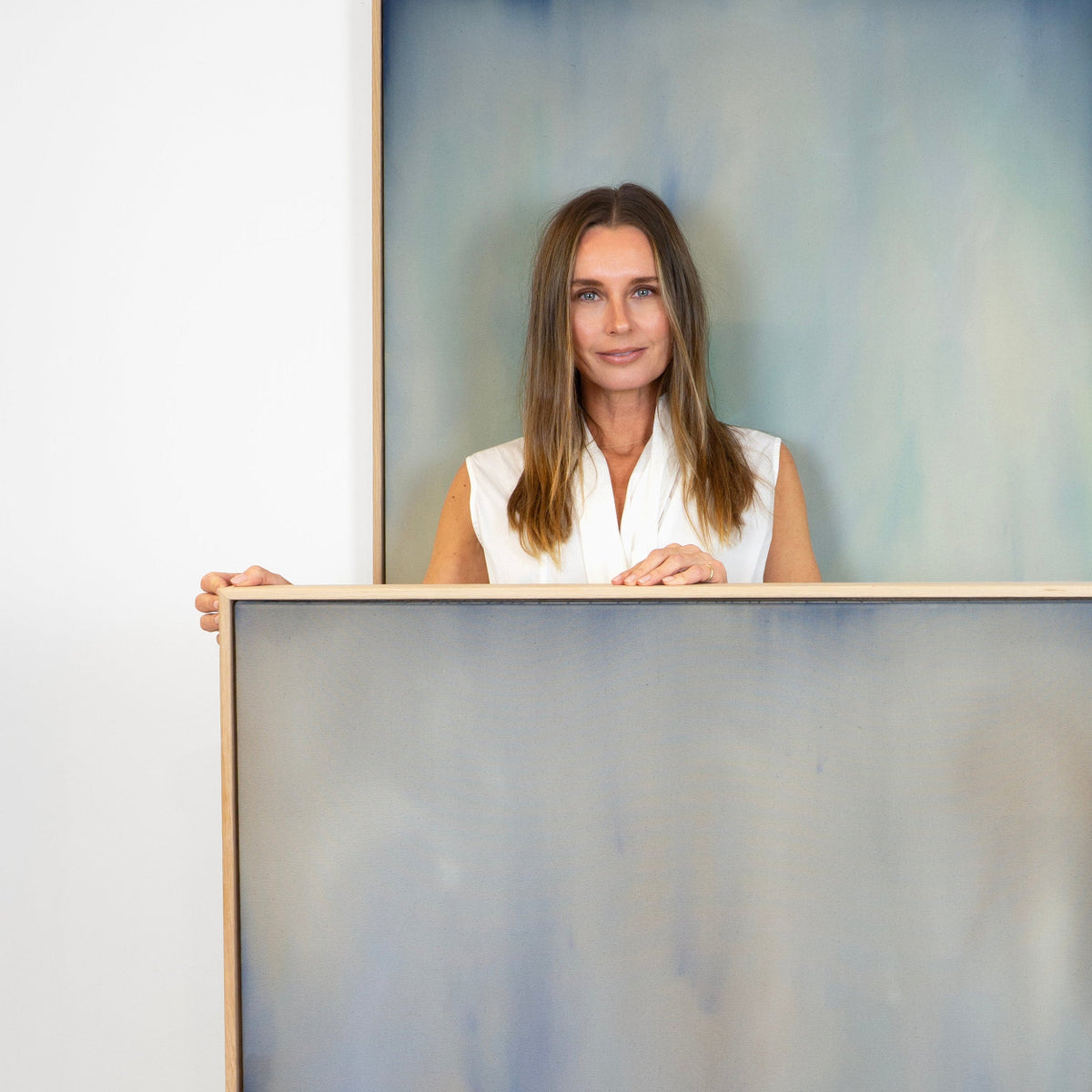 Artist Michelle Witters with her artworks