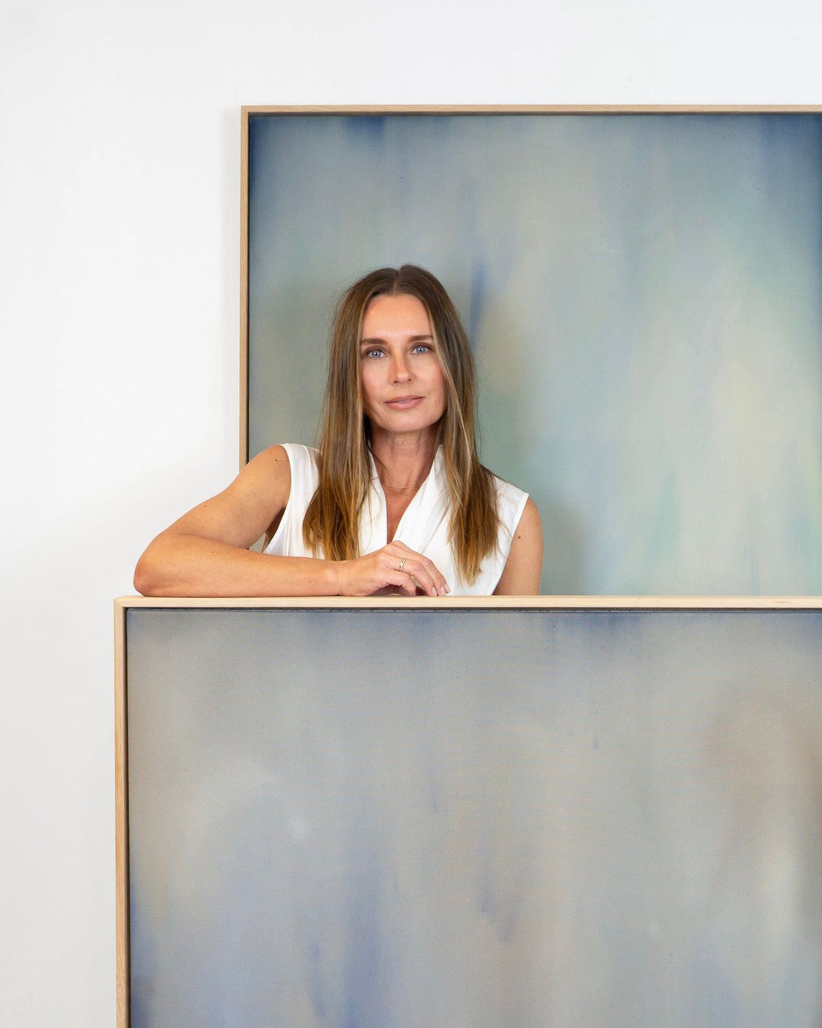 Artist Michelle Witters with her abstract minimalism artwork